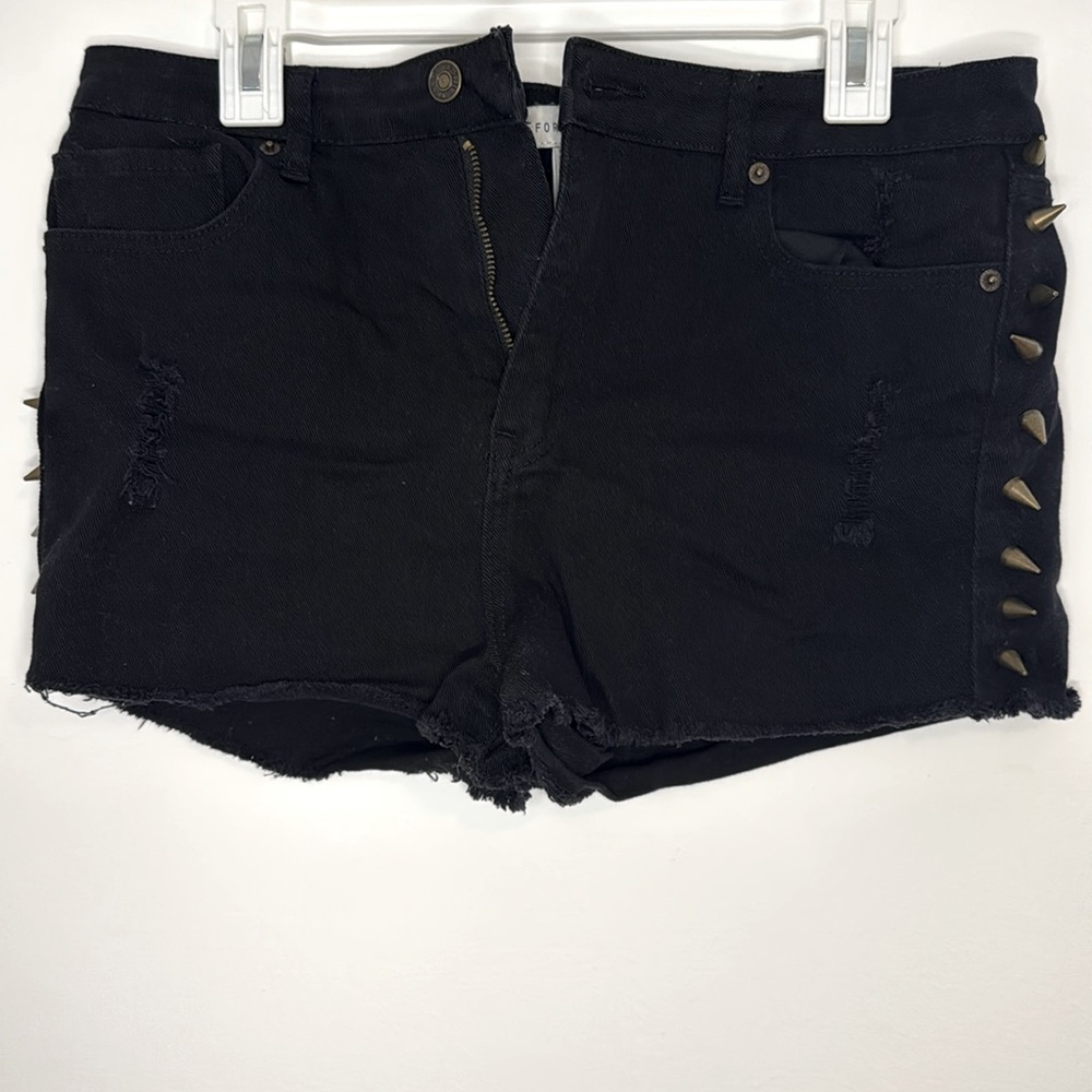 Black short-shorts with bronze spikes. Forever 21 brand. Size US 31.